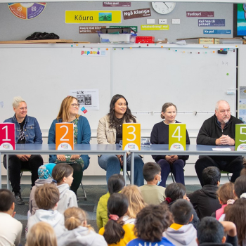 Role models on a panel during an event