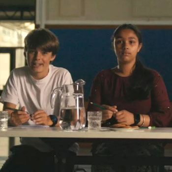 Two young students on an interview panel